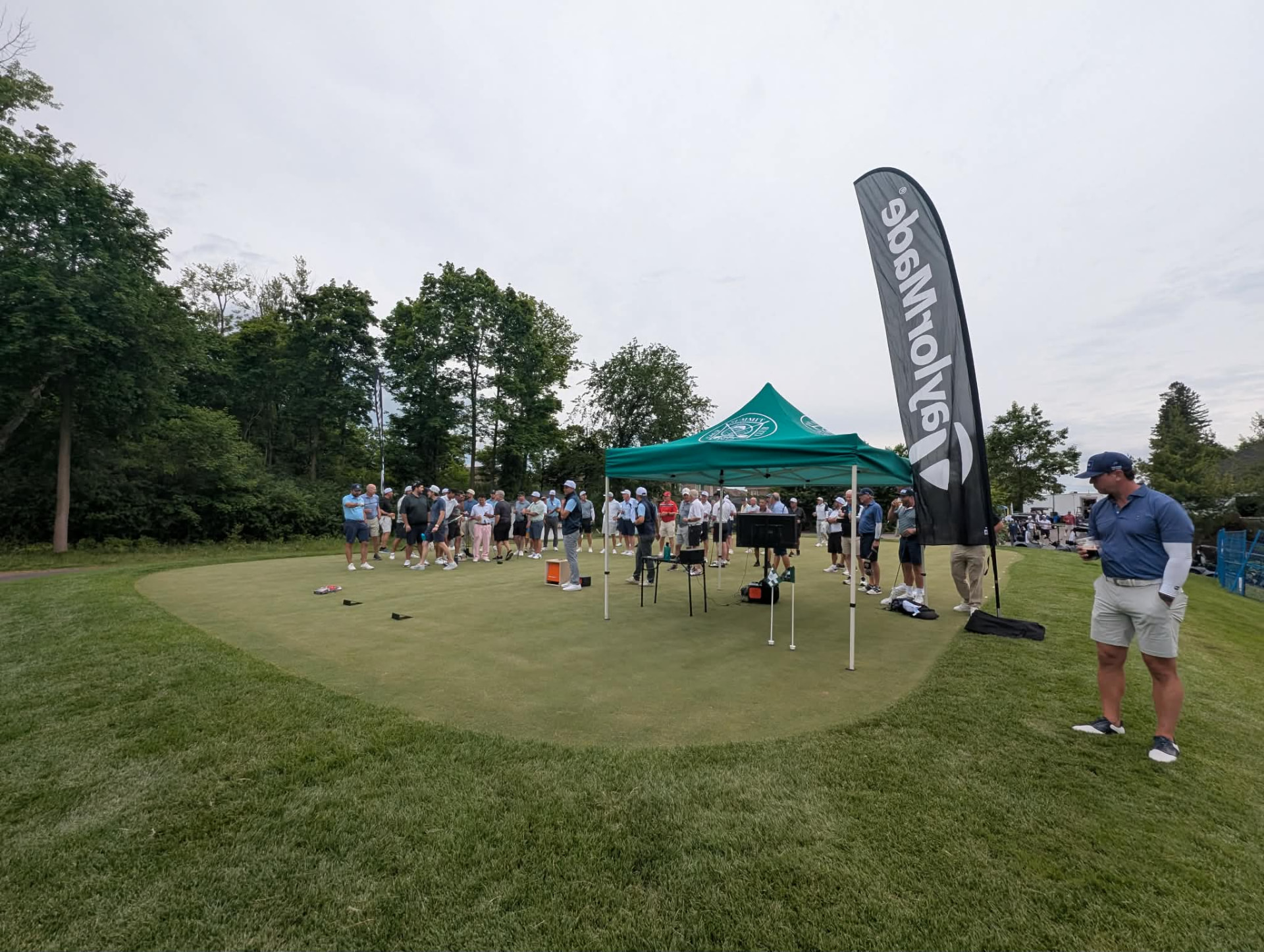 Wide shot of the TrackMan long drive setup at an outdoor tournament