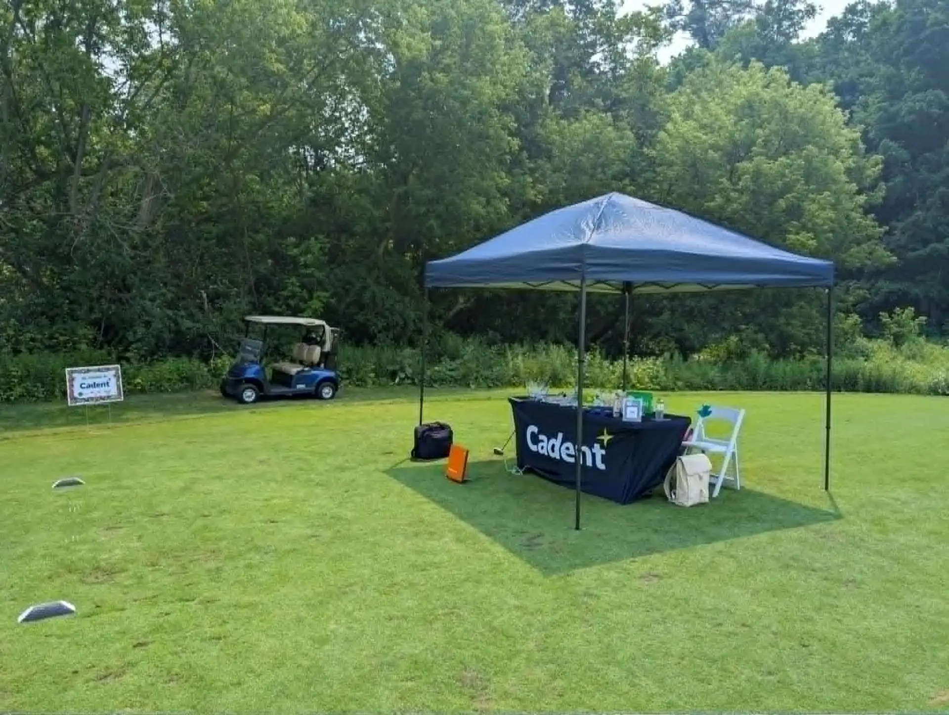 TrackMan on-course activation with sponsor tent on a fairway